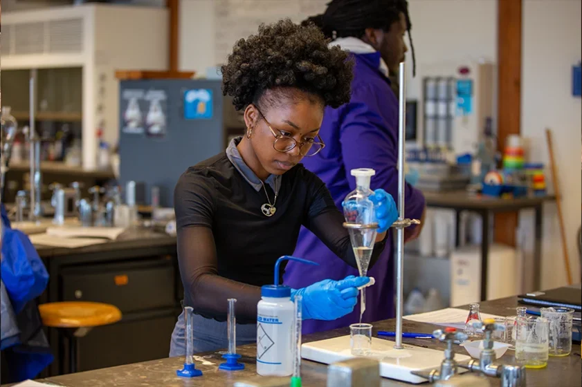 a student uses a pipet in class