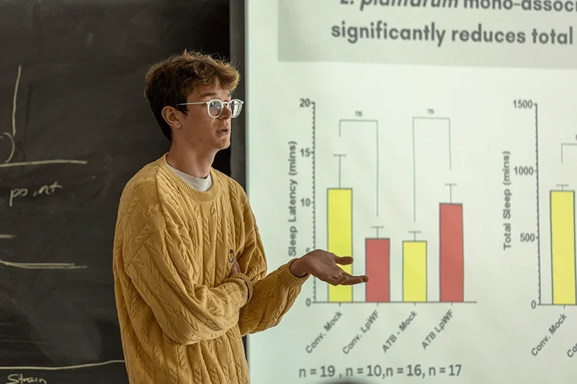 a student presents a slideshow on their scientific findings