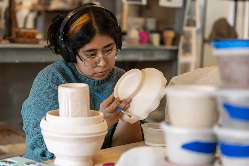 a student works on her art