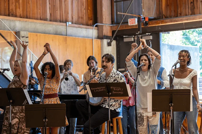 a group of students sing at a performance